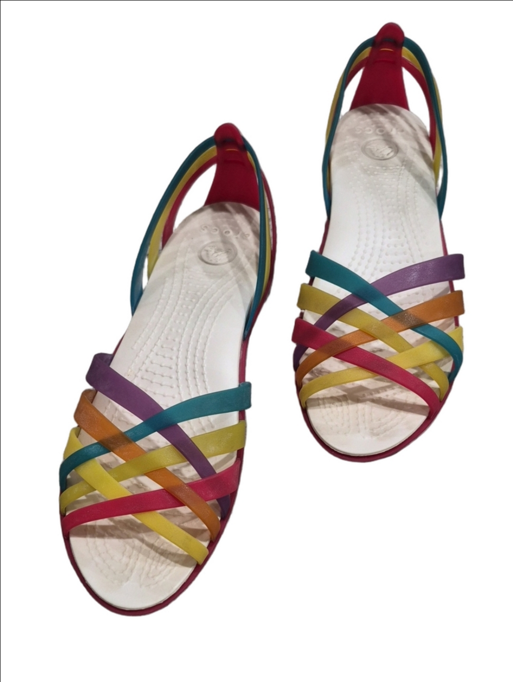 Crocs Huarache Flat Sandals featuring rainbow-colored translucent straps.